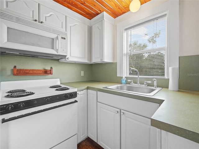 kitchen with white appliances, white cabinetry, sink, and wooden ceiling