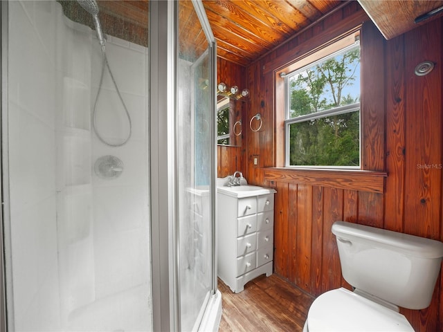 bathroom featuring wooden walls, toilet, wooden ceiling, and walk in shower