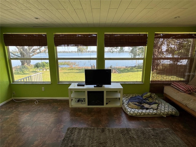 unfurnished sunroom with plenty of natural light and wooden ceiling