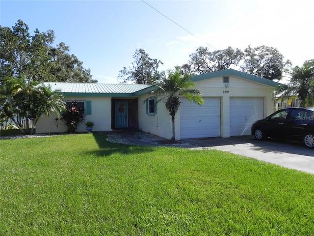 single story home with a front yard and a garage