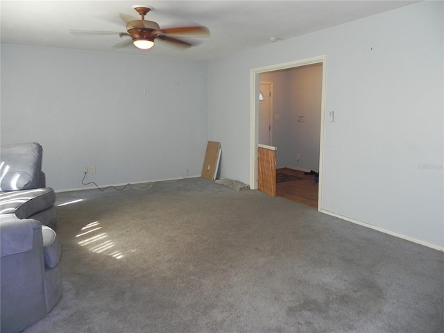 unfurnished living room with carpet floors and ceiling fan