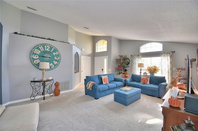 living room featuring high vaulted ceiling, carpet flooring, and a textured ceiling