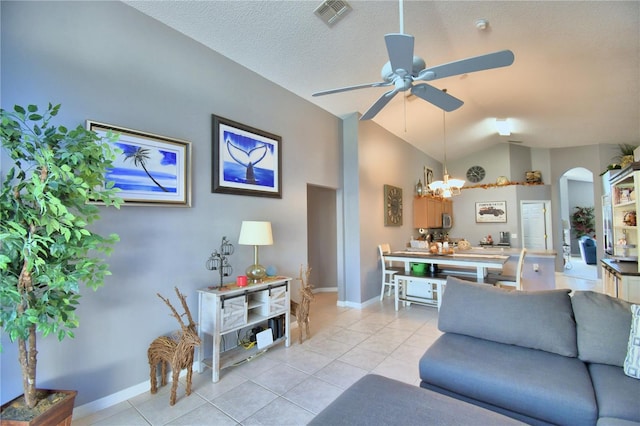 living room featuring a textured ceiling, light tile patterned floors, ceiling fan with notable chandelier, and vaulted ceiling