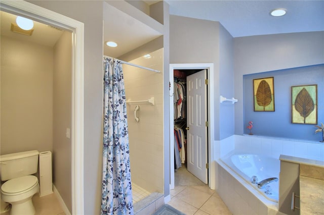 bathroom with toilet, tile patterned flooring, and plus walk in shower