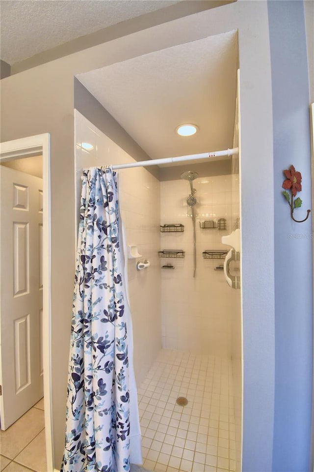 bathroom featuring tile patterned flooring and a shower with curtain