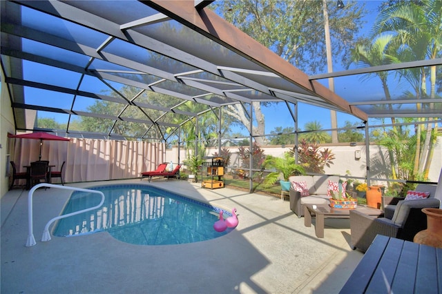 view of pool featuring a patio and glass enclosure