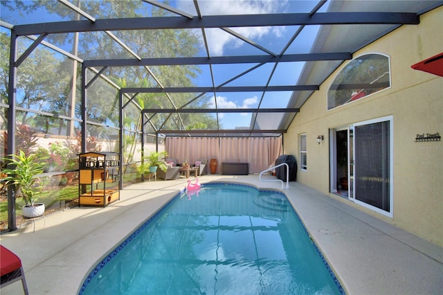 view of pool featuring a patio and a lanai