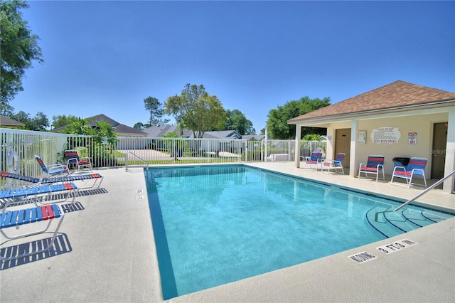 view of swimming pool with a patio