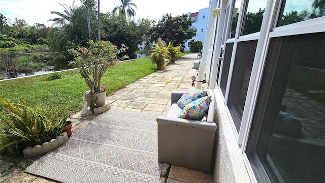 view of patio / terrace with a water view