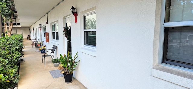 view of side of property featuring a porch