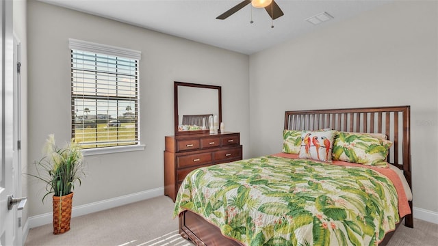 bedroom featuring light colored carpet and ceiling fan