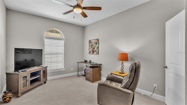 sitting room featuring light carpet and ceiling fan