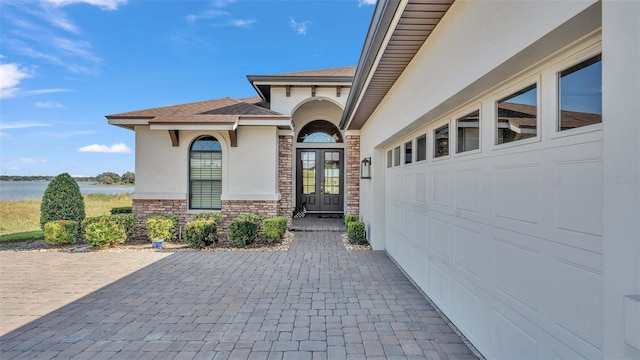 entrance to property with a water view