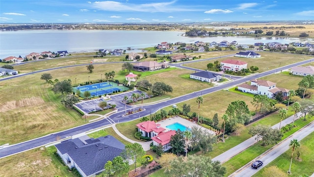 birds eye view of property with a water view