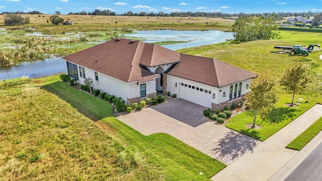 birds eye view of property with a water view