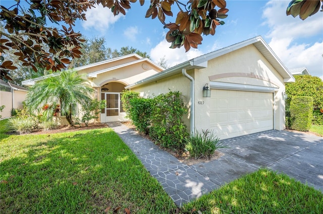 single story home featuring a garage, stucco siding, driveway, and a front lawn