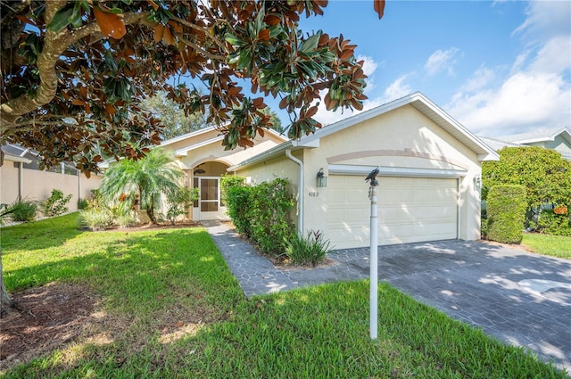 ranch-style home with a garage and a front lawn