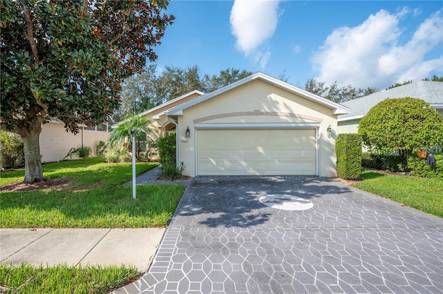 ranch-style house with an attached garage, stucco siding, a front lawn, and driveway
