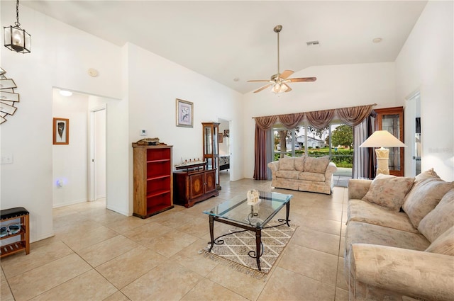 tiled living room featuring ceiling fan and high vaulted ceiling