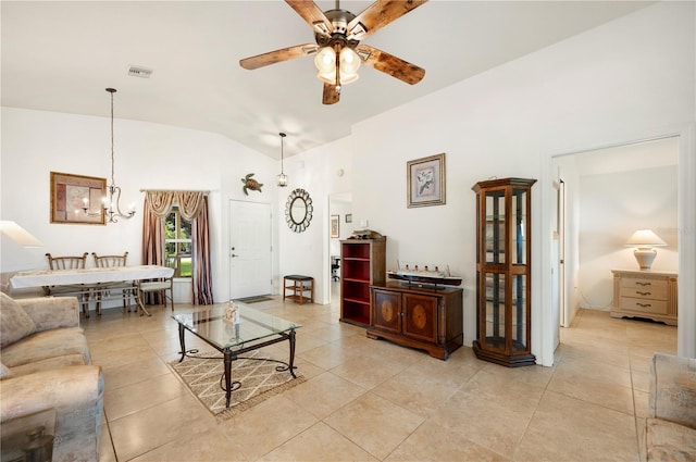 living room featuring ceiling fan with notable chandelier, lofted ceiling, and light tile patterned floors