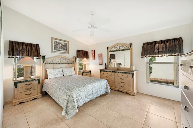 tiled bedroom with lofted ceiling and ceiling fan