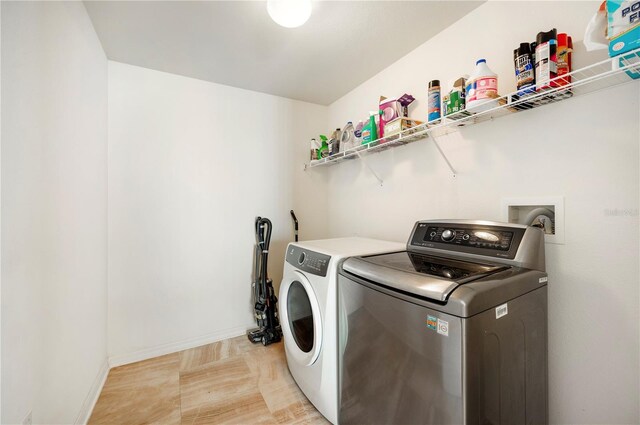 washroom with washer and clothes dryer