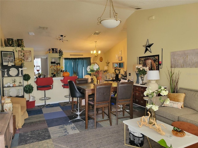 dining space featuring dark carpet, lofted ceiling, and an inviting chandelier