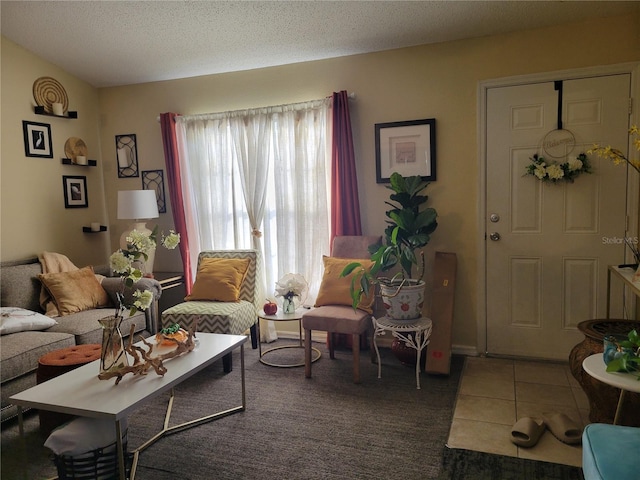 living room featuring tile patterned floors and a textured ceiling