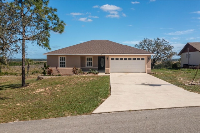 view of front of property with a front lawn and a garage