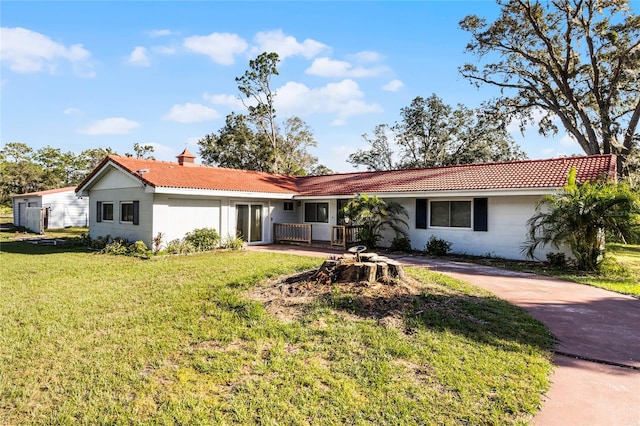 ranch-style house with a front yard