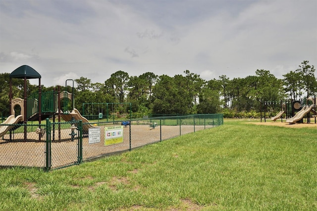 view of jungle gym featuring a lawn