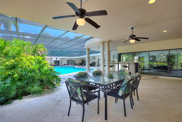 view of patio / terrace with a lanai and ceiling fan