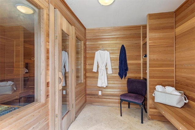 bathroom featuring wood walls