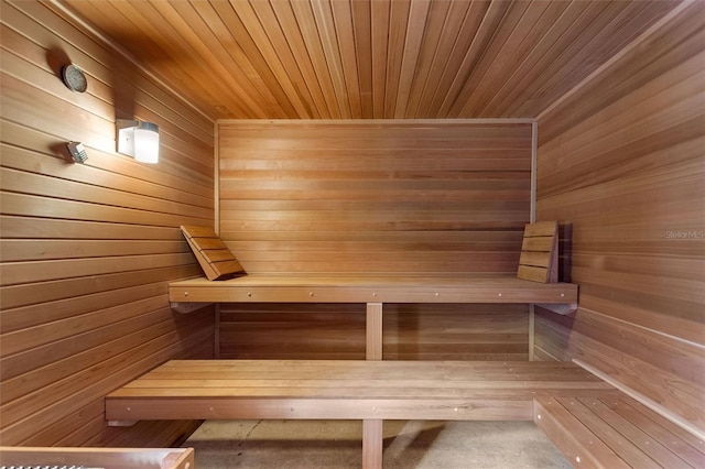 view of sauna featuring wood walls