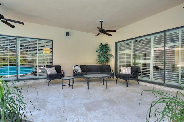 view of patio / terrace with ceiling fan and outdoor lounge area