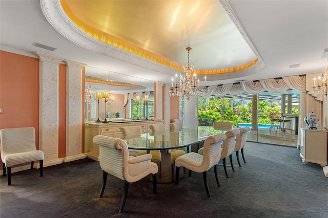 carpeted dining area featuring a tray ceiling