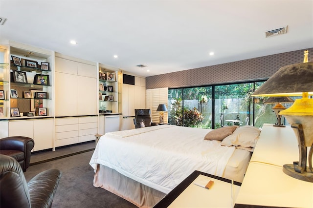 bedroom with dark colored carpet