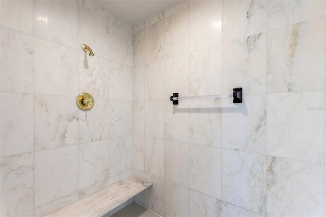 bathroom with tiled shower