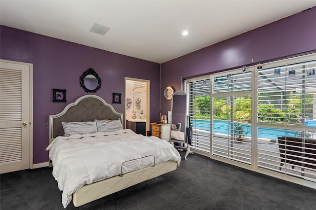 carpeted bedroom with access to exterior and multiple windows