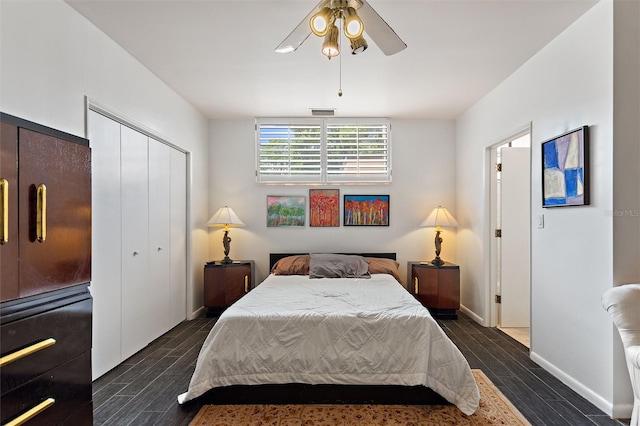 bedroom with a closet, dark hardwood / wood-style floors, and ceiling fan