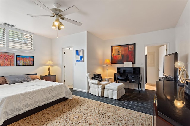 bedroom featuring ceiling fan and dark hardwood / wood-style flooring