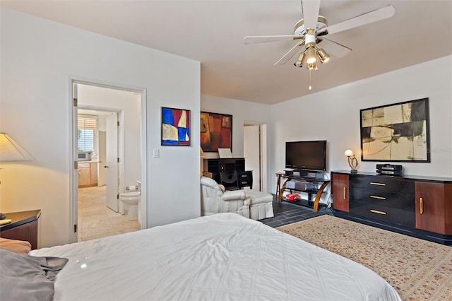 bedroom with ensuite bath and ceiling fan