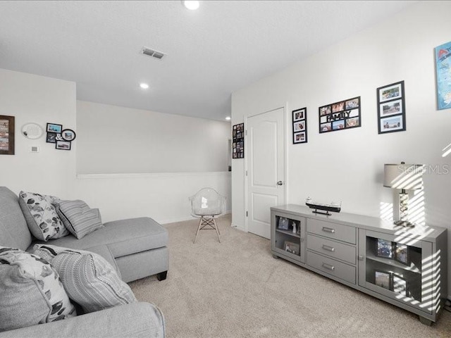 living room featuring light colored carpet