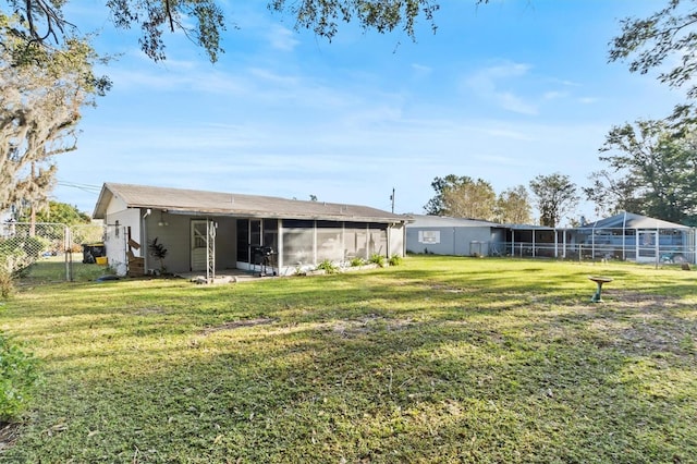 view of yard featuring a sunroom