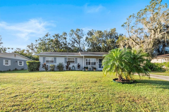 ranch-style home with a front yard