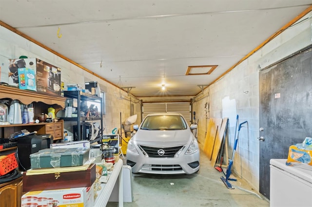 garage featuring white fridge