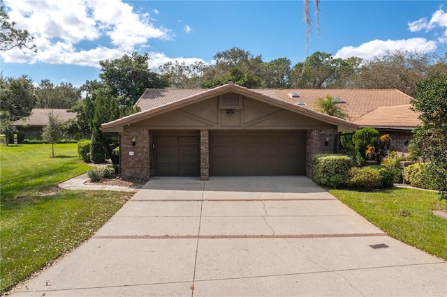 ranch-style home with a garage and a front lawn