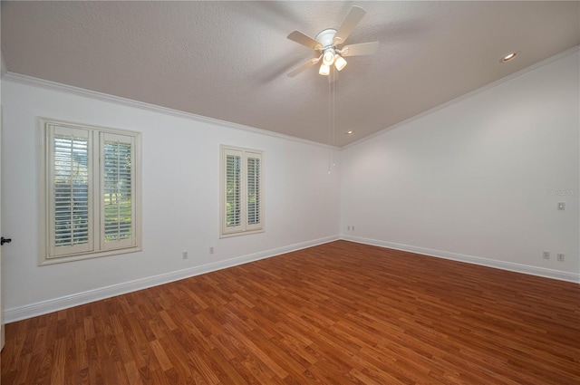 empty room with ceiling fan, crown molding, wood-type flooring, and a textured ceiling