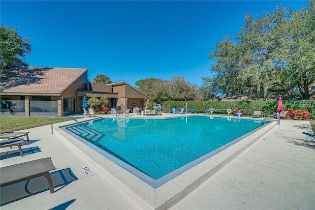 view of swimming pool with a patio area