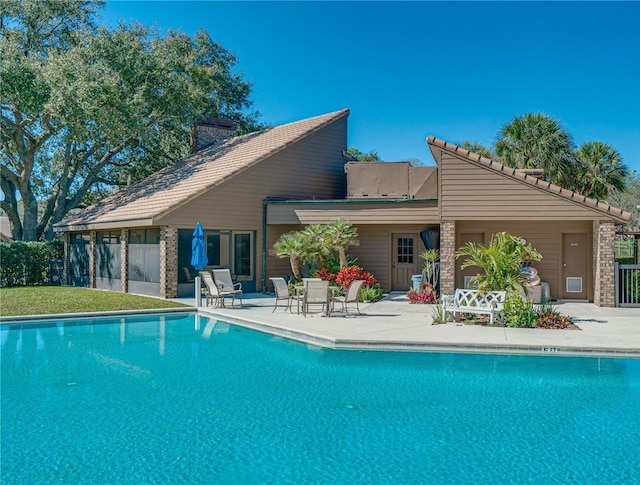 view of pool featuring a patio area